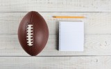 Fantasy Football Draft still life. A pad and pencil and an Ameri