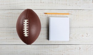 Fantasy Football Draft still life. A pad and pencil and an Ameri