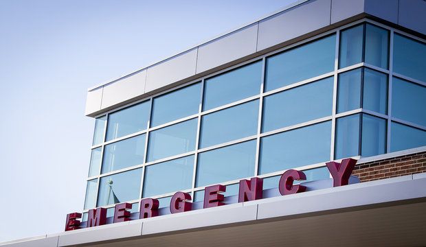 Emergency room entrance with red block letters on the metal awni