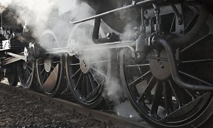 Steam locomotive rolling by close