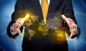 An elegant analytic person holding map of the world in its hand with numbers, statistics in front of blue background concept