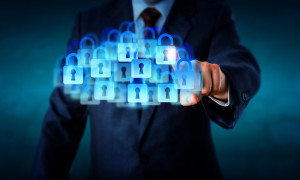 Management connecting with a super secure cloud by touch. Countless closed lock icons combine to shape the virtual cloud. Technology metaphor for corporate IT security privacy and cloud computing.