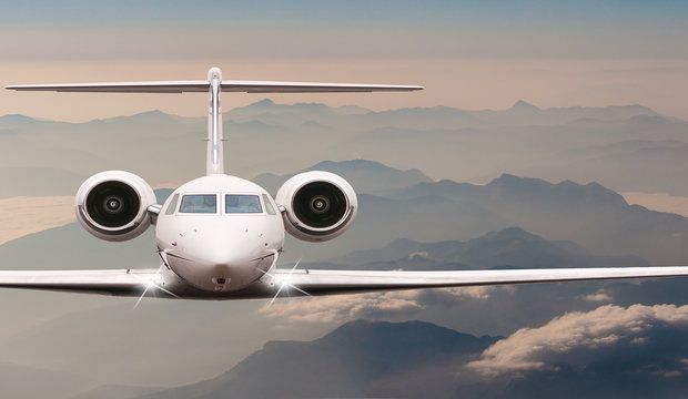 Travel by aircraft. Airplane fly over clouds and Alps mountain o