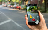 Montreal CA - August 10 2016: Closeup of a man playing Pokemon Go on a smart phone. Pokemon Go is a virtual reality game released in July 2016.