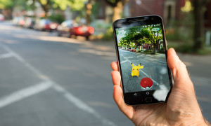Montreal CA - August 10 2016: Closeup of a man playing Pokemon Go on a smart phone. Pokemon Go is a virtual reality game released in July 2016.