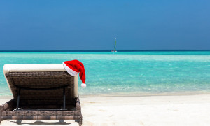 Sunbed with Christmas hat on a tropical beach