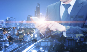 Double exposure of professional businessman using cloud technology in smart phone with servers technology in data center and network connection in IT Business technology concept world map from NASA
