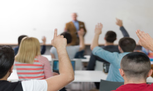 senior teacher teaching lessons, smart students group raise hands up in school classroom on class