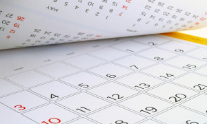 desk calendar with days and dates in July 2016, flip the calendar page