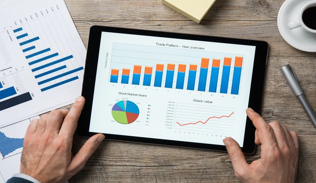 Top view of digital tablet with financial year overview on scree