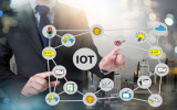 IOT business man hand working and internet of things (IoT) word diagram as concept and businessman working with modern technology