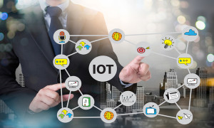 IOT business man hand working and internet of things (IoT) word diagram as concept and businessman working with modern technology