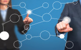 business man and women hand drawing blank flow chart on new modern computer as concept. Isolated on blue. Stock Image