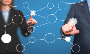 business man and women hand drawing blank flow chart on new modern computer as concept. Isolated on blue. Stock Image