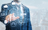 Double exposure of professional businessman connected devices with world digital technology internet and wireless network on touch screen and city of business background in business and technology concept