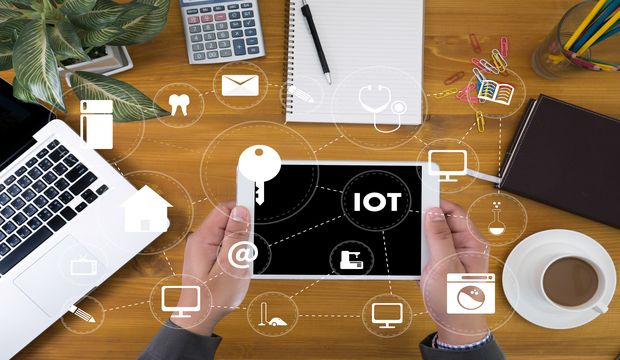 Iot Business Man Hand Working And Internet Of Things (iot) Word