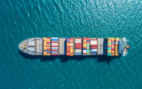 container ship in import export and business logistic.By crane Trade Port Shipping.cargo to harbor.Aerial view.Water transport.International.Shell Marine.Top view.
