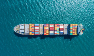 container ship in import export and business logistic.By crane Trade Port Shipping.cargo to harbor.Aerial view.Water transport.International.Shell Marine.Top view.