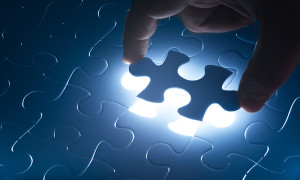 Missing jigsaw puzzle piece with light glow, business concept for completing the final puzzle piece