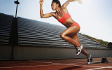 Women running on athletic track
