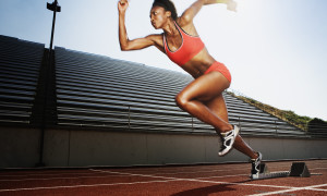 Women running on athletic track