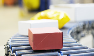Packages on conveyor belt in warehouse