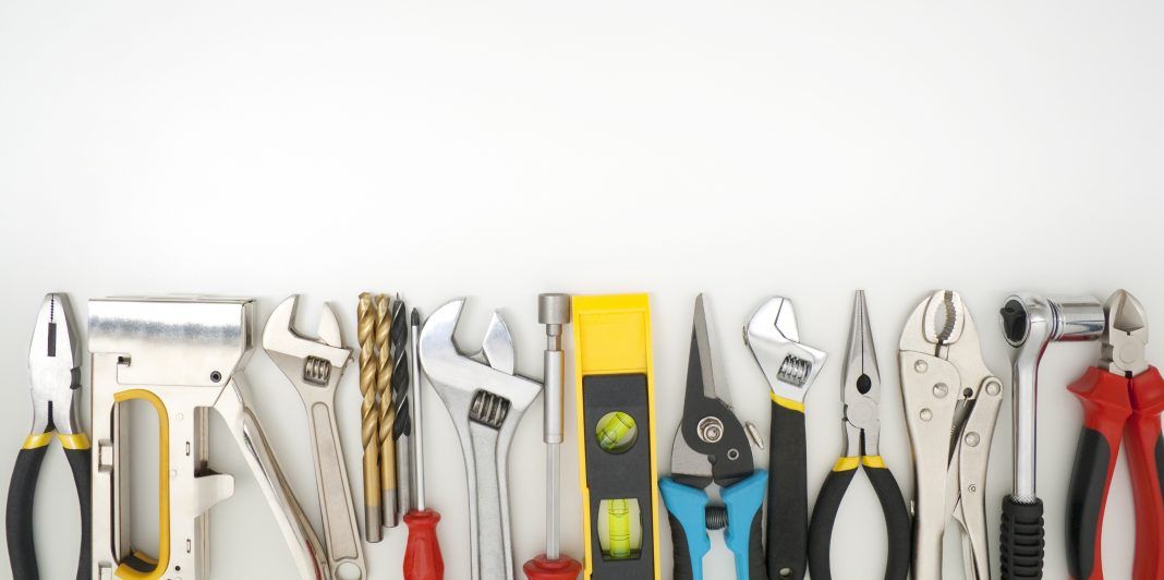 Work tools lined up on a white background
