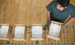 Man carrying a box full of styrofoam