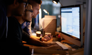 Cropped shot of a group of young coworkers working in a dimly-lit officehttp://195.154.178.81/DATA/i_collage/pi/shoots/783867.jpg