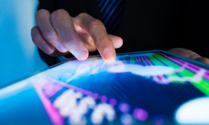 Market Analyze with Digital Moniter focus on tip of finger