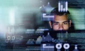 Cropped shot of a young computer programmer looking through data