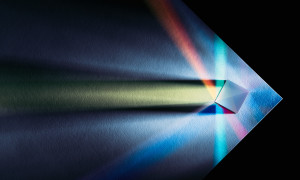 Prism Multi-colored Refraction on the Edge of White Paper, Directly Above View.