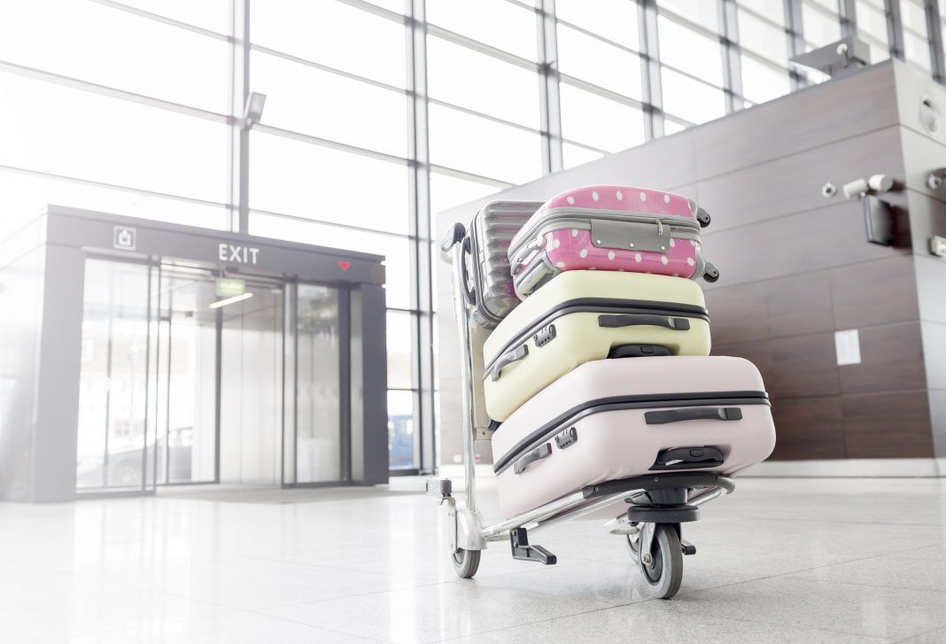 Baggage cart with suitcases at the aiport