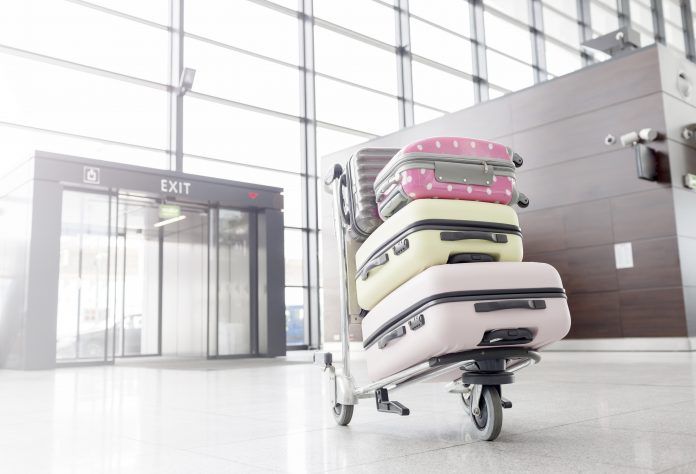 Baggage cart with suitcases at the aiport