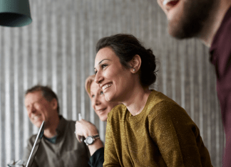 woman smiling at meeting