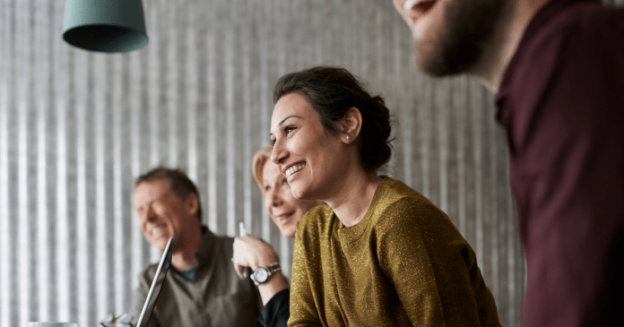 woman smiling at meeting