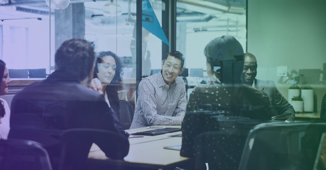 People having a meeting in an office conference room