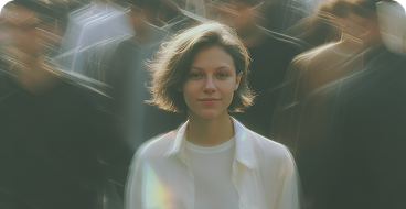 Person in a white shirt standing among a crowd of people