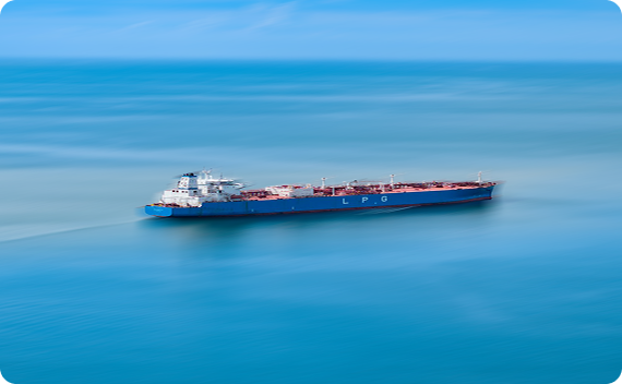 Large cargo ship sailing on calm blue ocean.