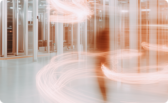 Server room with orange light trails creating dynamic motion effect.