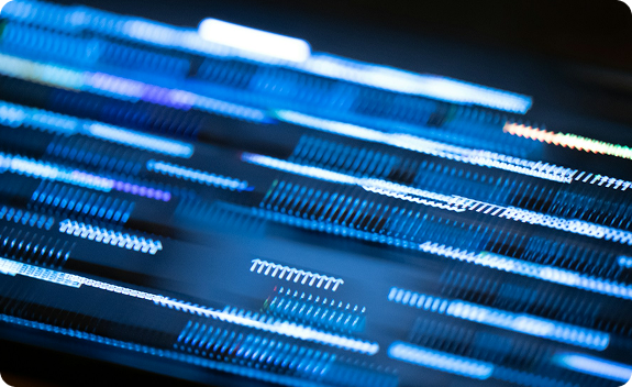 Blue and white light streaks in motion on a dark background
