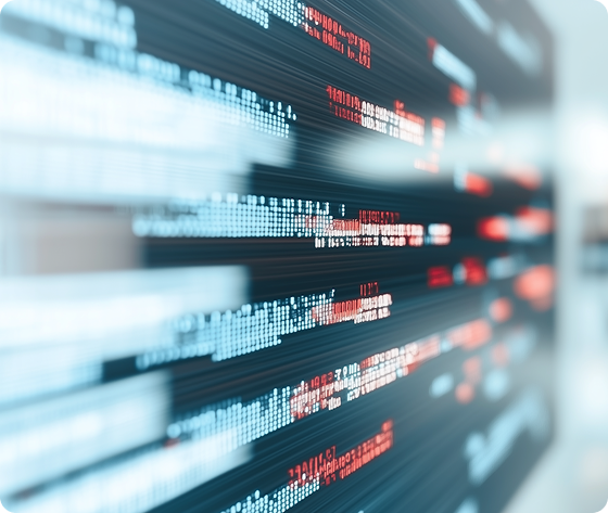 Close-up of computer code lines in white and red on a dark screen.